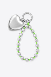 Heart And Ball Strap Keyring In Neon Green